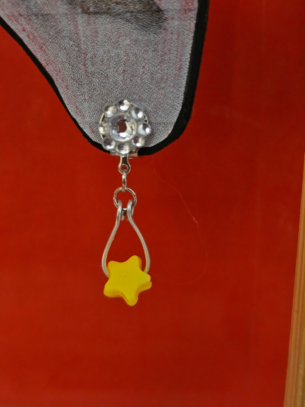 Tear drop wired clip on earing with star bead