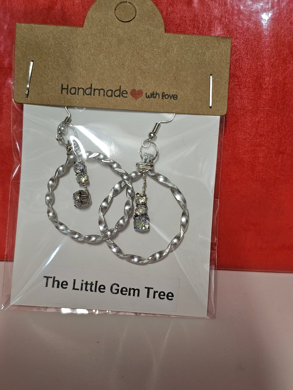 Twisted round earrings with 3 diamond drops