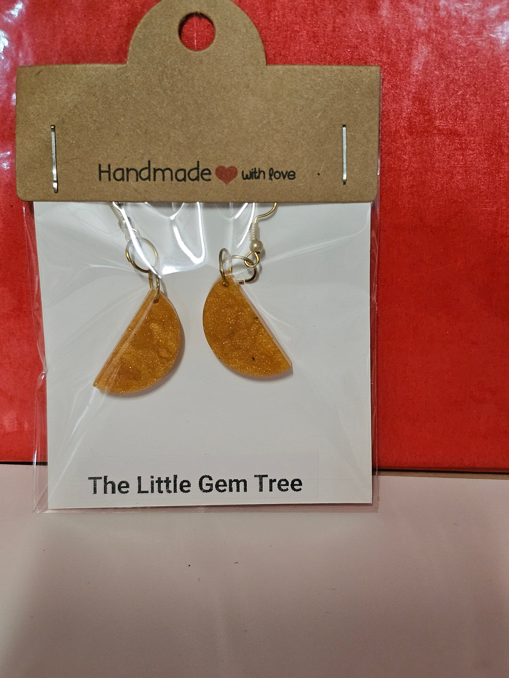 orange resin half circle earrings
