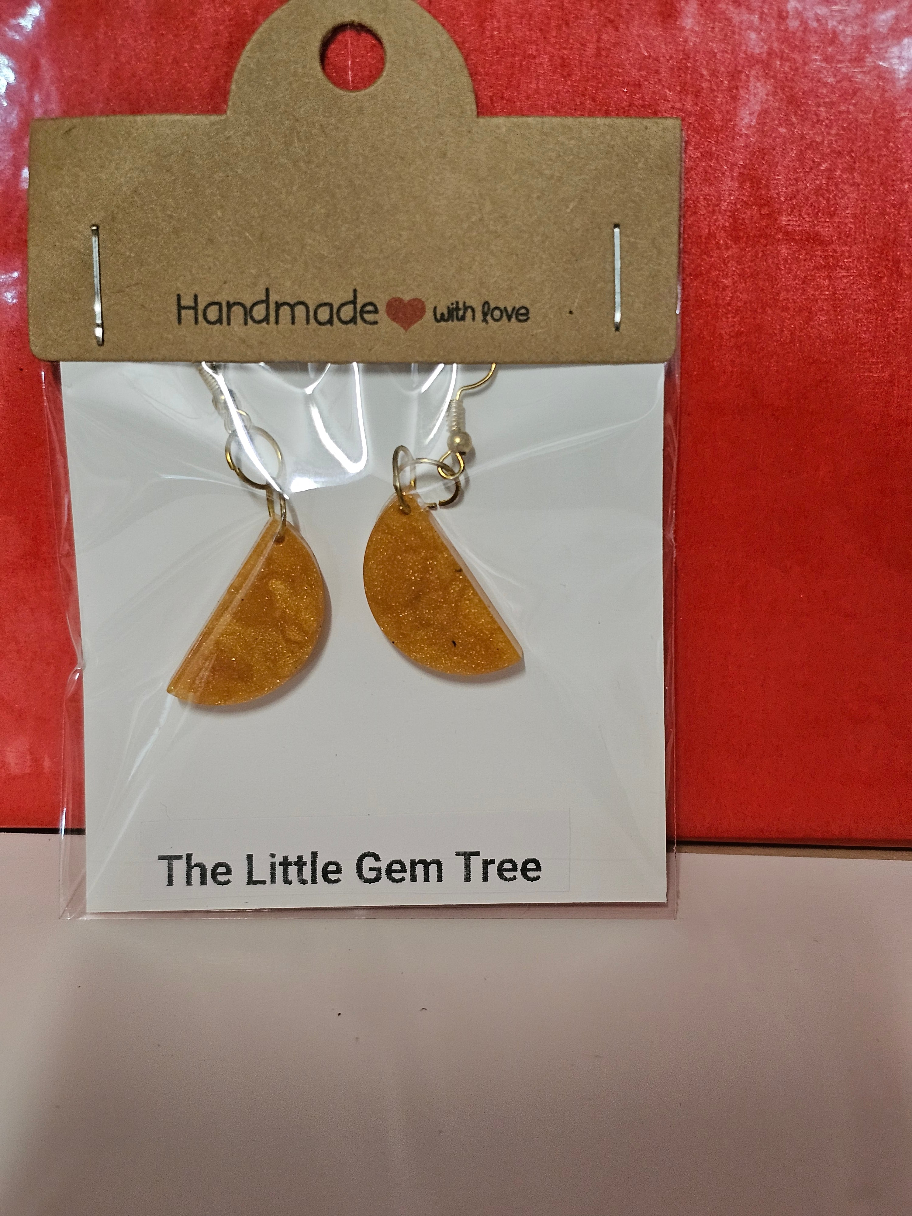 orange resin half circle earrings