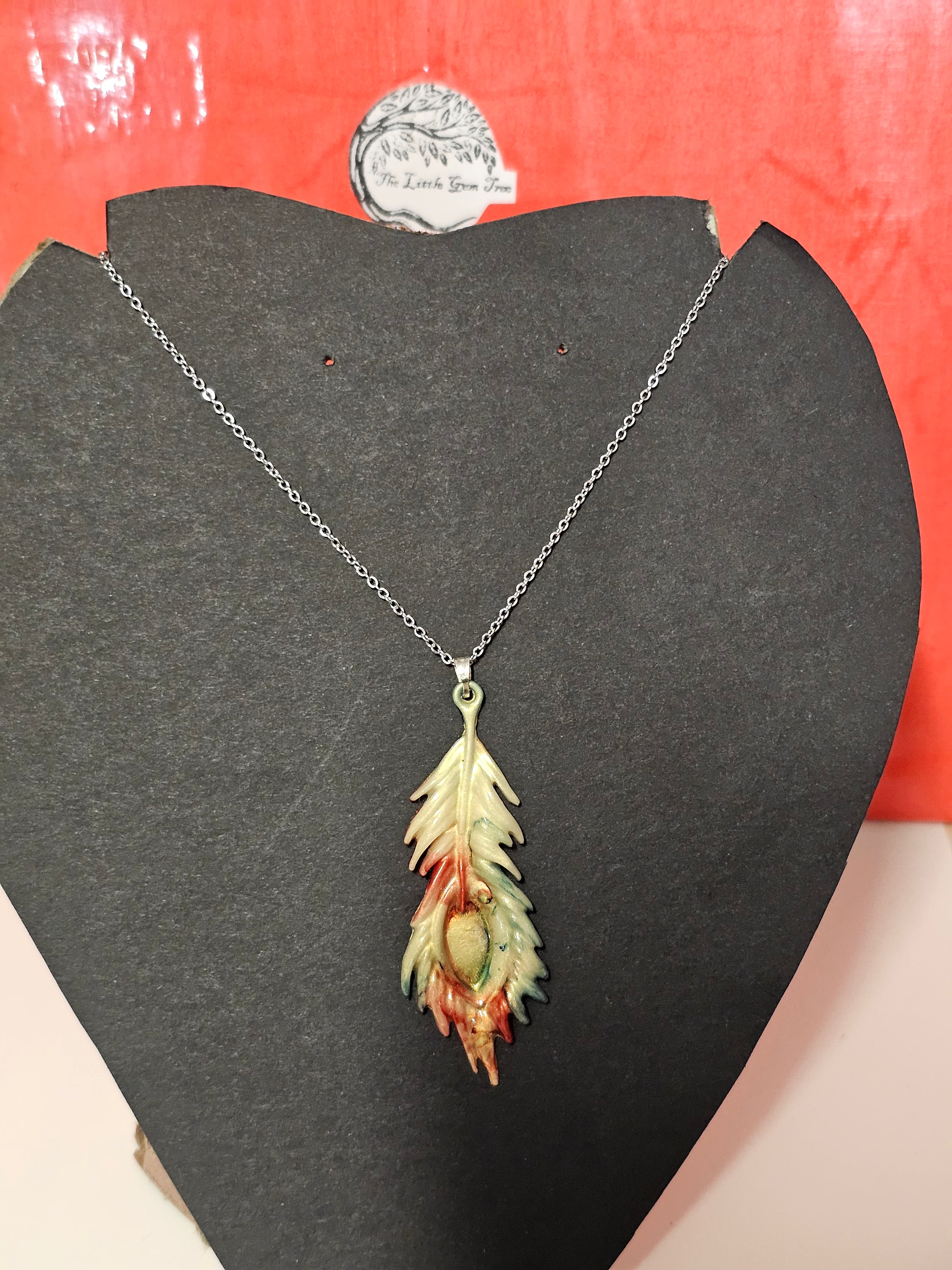 Indian style feather in pearl, gold, red and blue pendent and chain