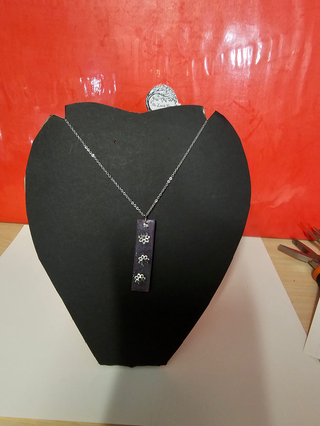Square purple drop pendent with 3 silver flowers plus chain