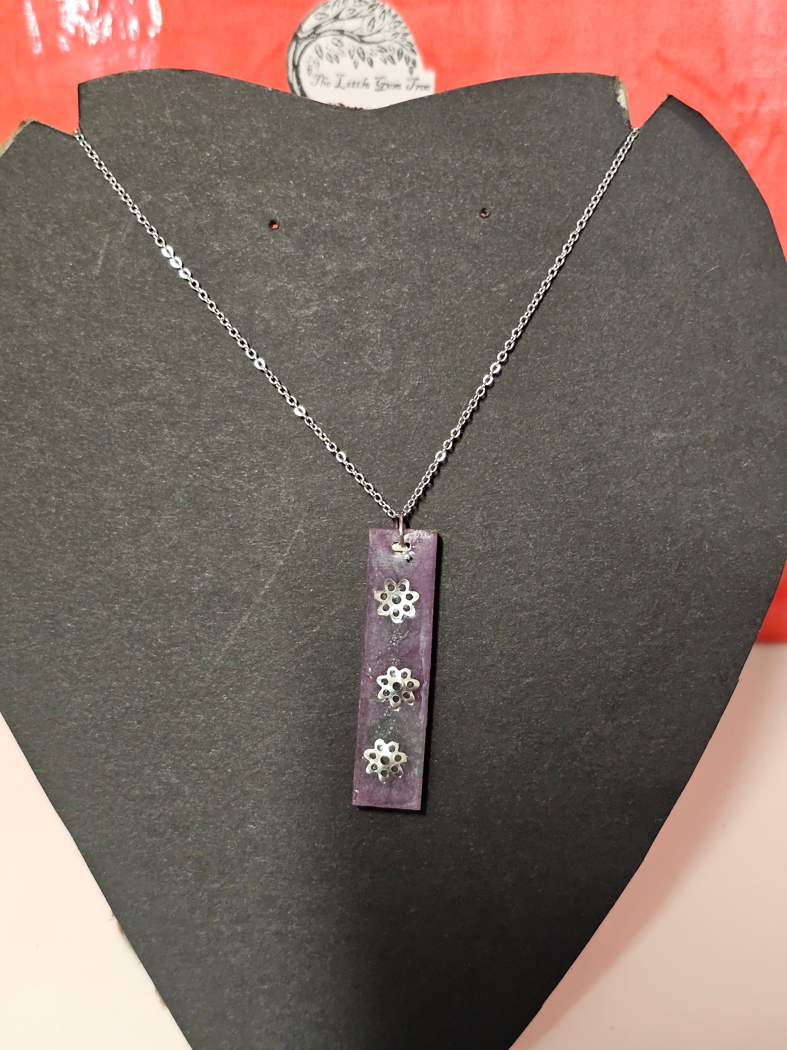Square purple drop pendent with 3 silver flowers plus chain