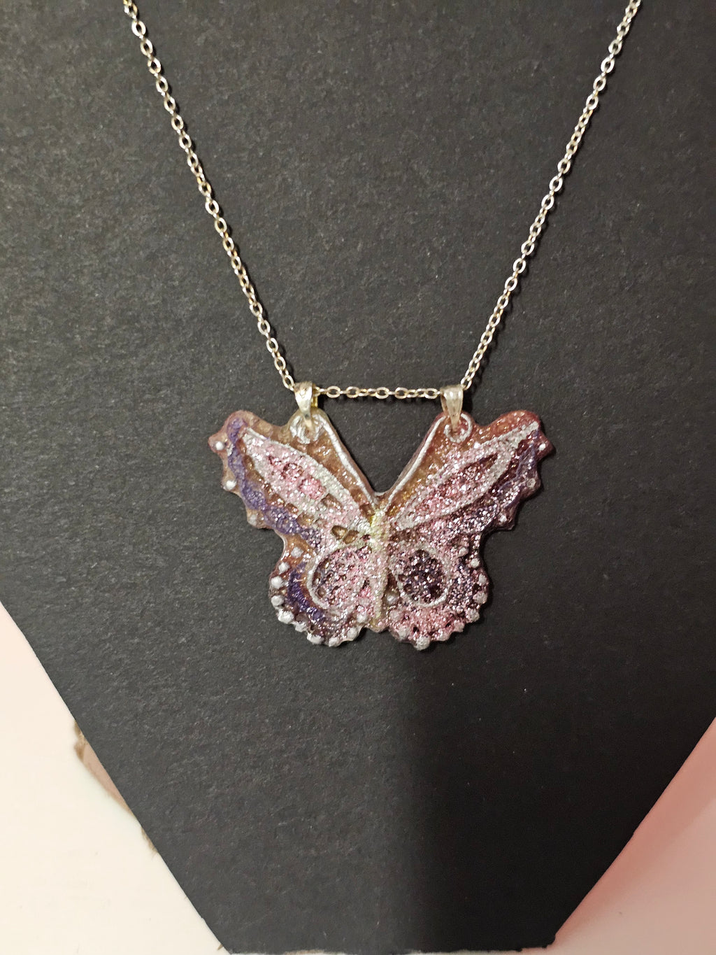 pink hues resin butterfly pendent