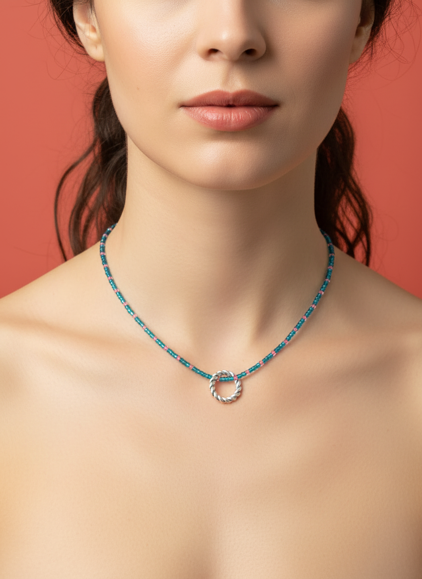 blue and pink chain witha silver circle pendent