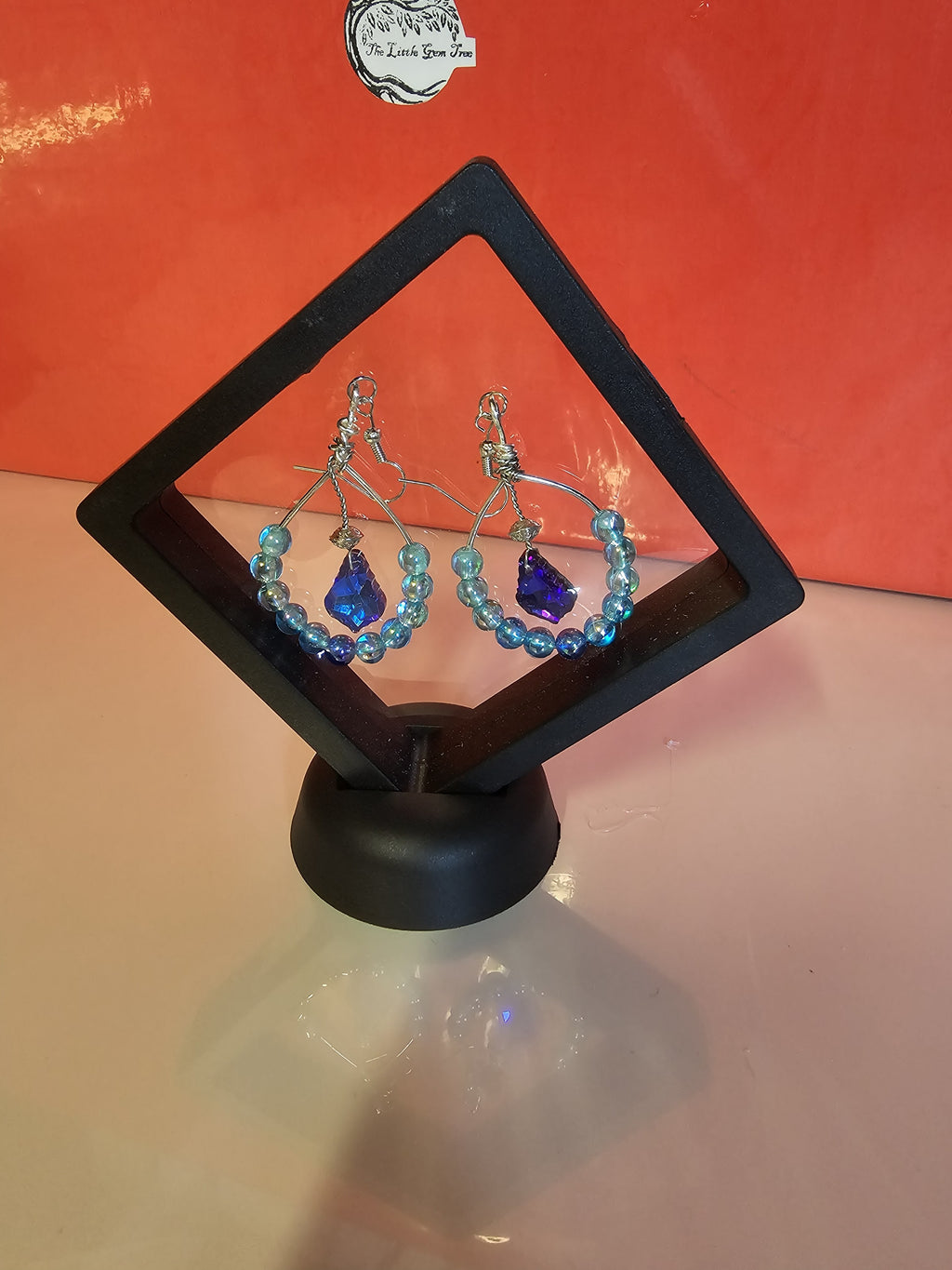 silver and blue hooped earrings