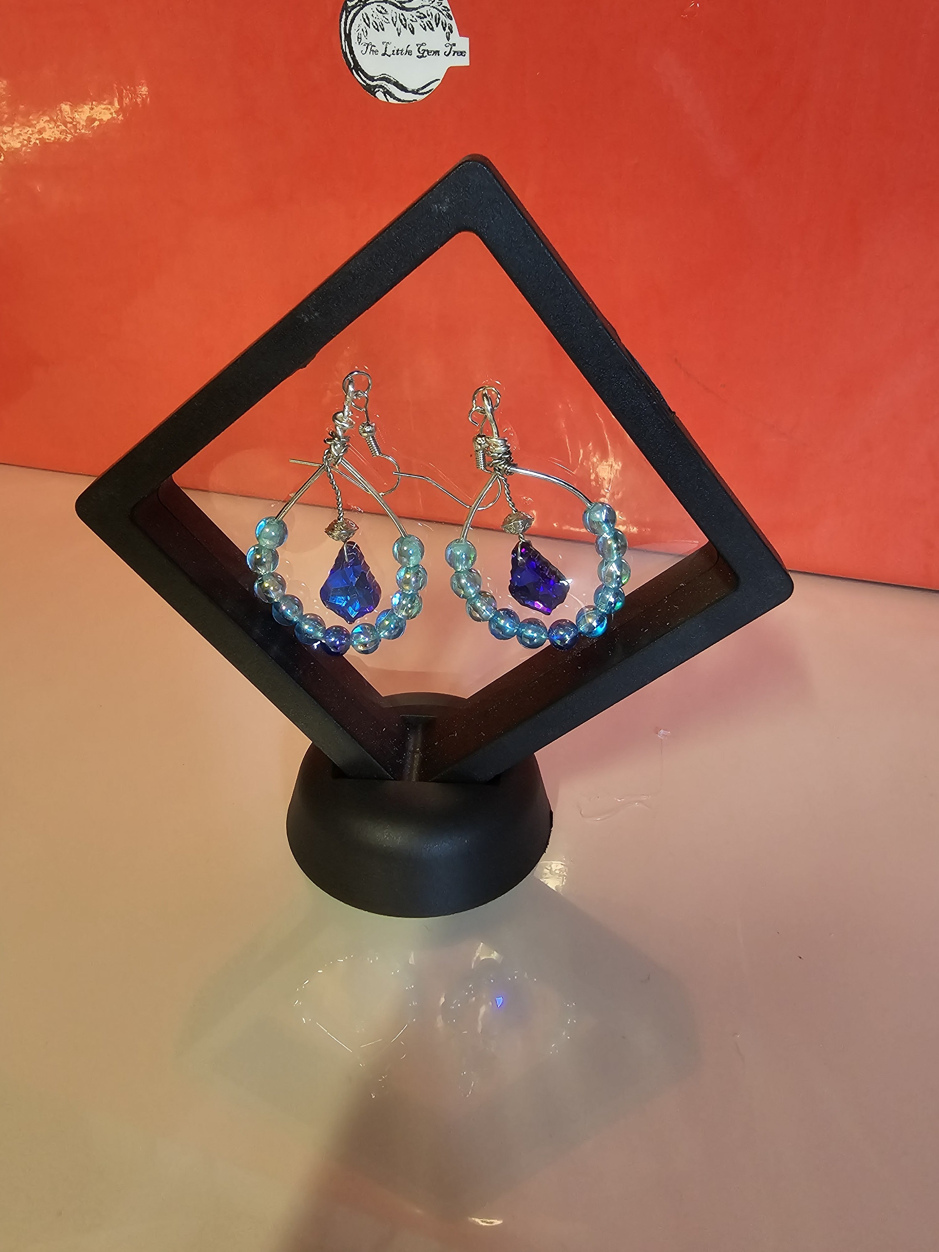 silver and blue hooped earrings