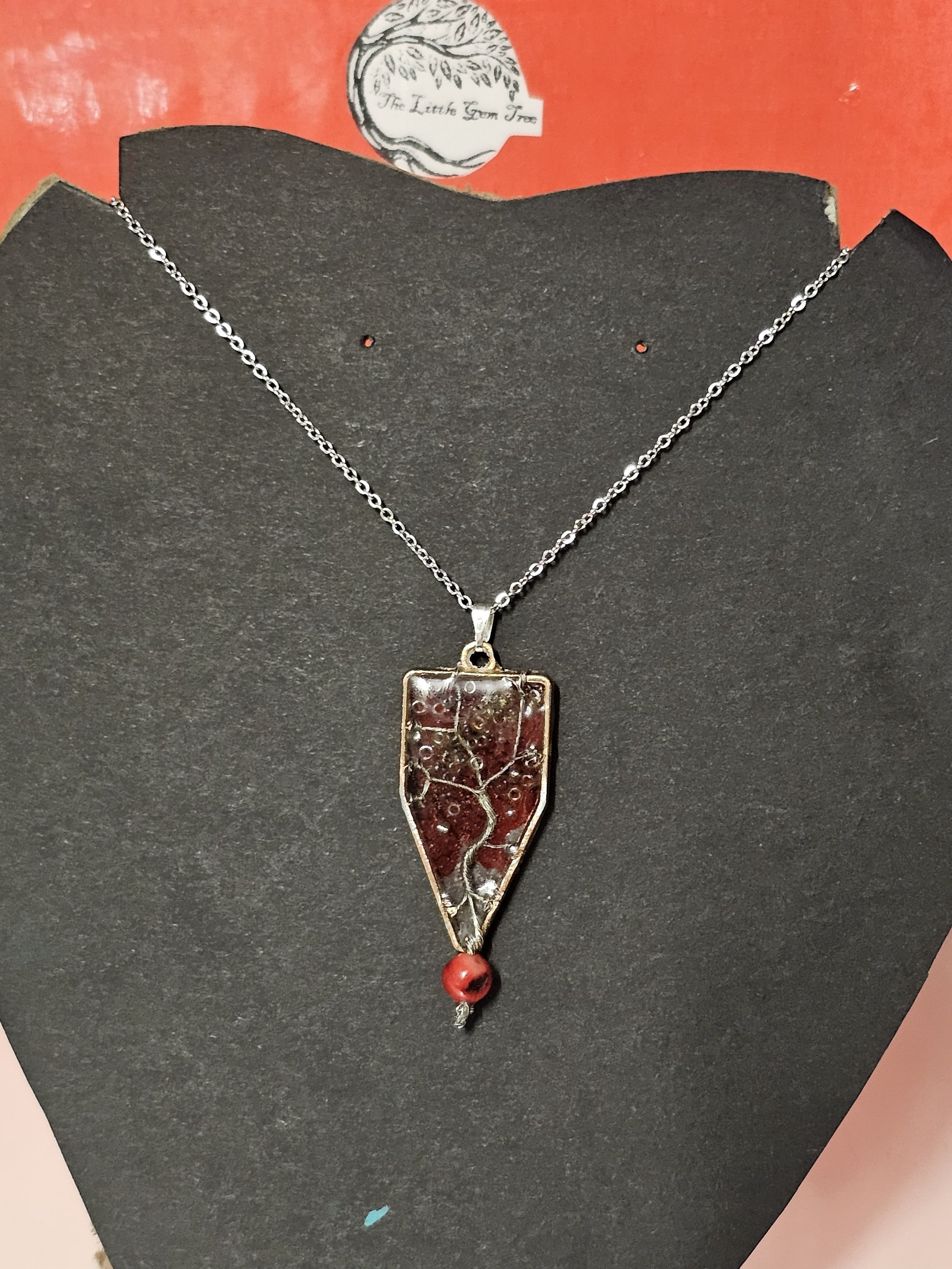 tree of life in resin with a red leaf background pendent