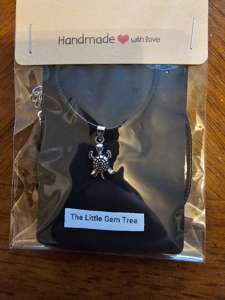 Silver turtle pendent on cord