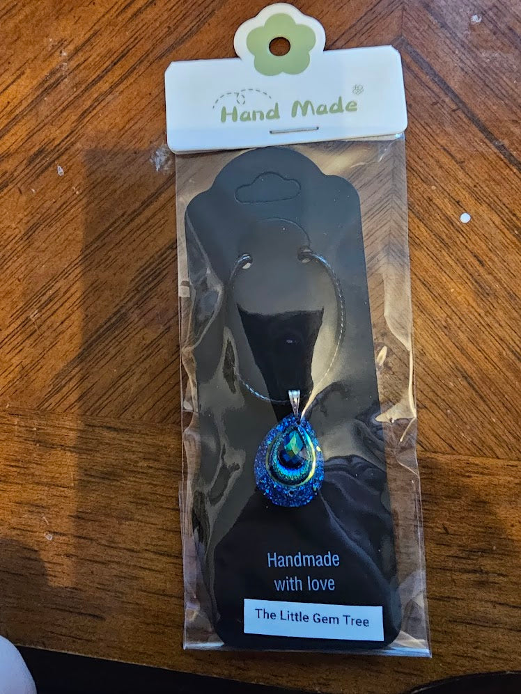 peacock pendent on cord