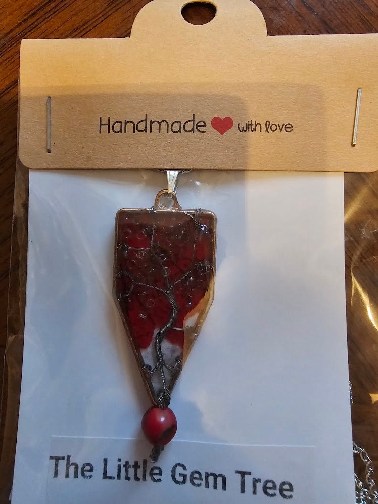 tree of life in resin with a red leaf background pendent
