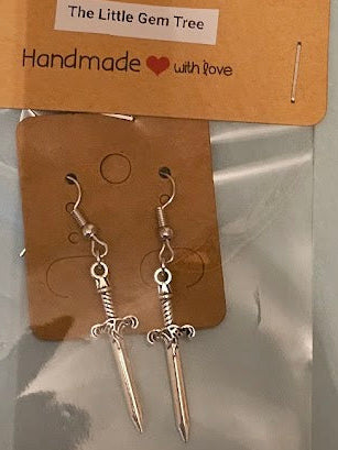 Pair of silver earrings on a 'The Little Gem Tree' branded card.